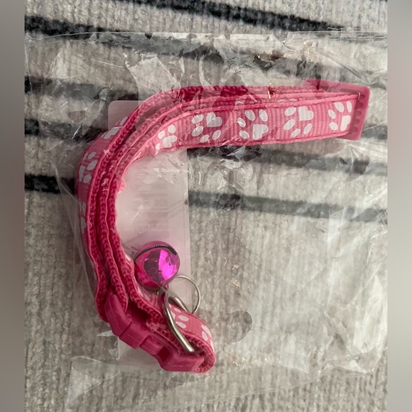 Collar with White Paw Print Pattern and Matching Bell and Buckle - Picture 9 of 15